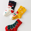 Lot de 5 chaussettes enfant. Modèle mixte : fille et garçon. Motifs de noël : sapin de noël, flocons, renne, père noël. 