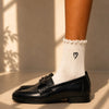 Chaussettes ajourées cœur et feston femme, douces et stretch avec petit cœur brodé. Taille unique 35-41, disponibles en blanc et noir.