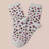 Chaussettes montantes femme, fond beige lurex ou gris chiné, motif coeur et léopard. 