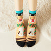 Chaussettes de Noël motif renne avec écharpe coloris noir beige et bleu 