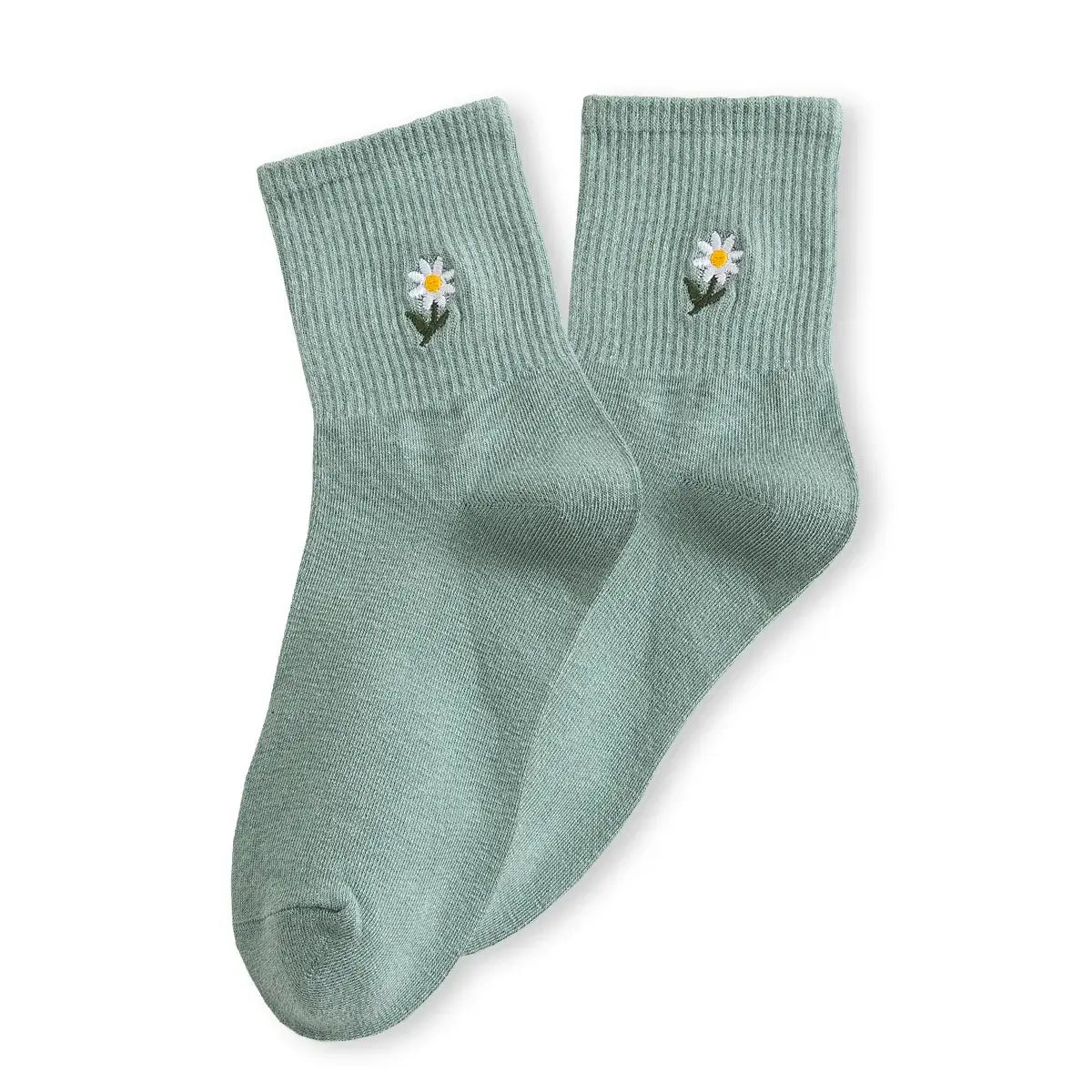 Chaussette haute unie avec marguerite brodée.