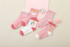 Lot de 5 chaussettes montantes, fond rose ou blanc, motifs variés : rayures, licornes, coeurs. Pour bébé et enfant (du 12 mois au 12 ans).