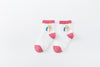 Chaussettes montantes, fond blanc, motif licornes. Pour bébé et enfant (du 12 mois au 12 ans).