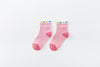 Chaussettes montantes, fond rose, motif coeurs. Pour bébé et enfant (du 12 mois au 12 ans).