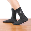 Chaussettes hautes lurex noir argenté. Motif festif brodé sur le côté : boule à facettes.