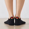 Chaussettes avec languette cœur arc-en-ciel.