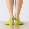 Chaussettes languette vertes, motifs avocats brodés sur la languette 