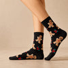 Chaussettes hautes, motif biscuits de Noël. Coloris noir. Douces et Chaudes. Également vendues en lot de 4. Idéales pour offrir. 