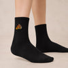 Chaussettes hautes sport, matière côtelée pour un bon ajustement, part de pizza brodée sur le côté