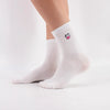 Chaussettes montante, unie blanche, tête de vache brodée sur le côté