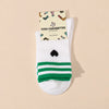 Chaussettes blanches femme à rayures et cœur, vendues à l’unité en noir ou vert. Douces et stretch, taille 35-41, pour un look sportif et tendance.