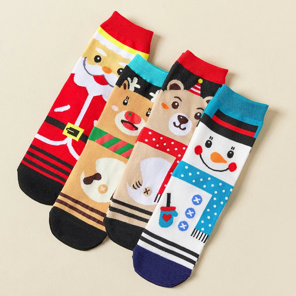Coffret de 4 chaussettes hautes costume de Noël : Père Noël, Bonhomme de Neige, Renne et Ours