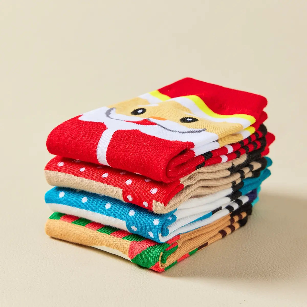 Coffret de 4 chaussettes hautes costume de Noël : Père Noël, Bonhomme de Neige, Renne et Ours