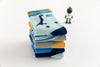 Lot de 5 chaussettes enfant bleues à motifs dinosaures. Confortables, douces et ludiques. Tailles de 12 mois à 12 ans. Parfait pour les petits explorateurs.