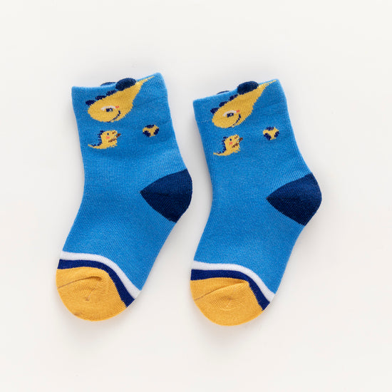 Lot de 5 chaussettes enfant bleues à motifs dinosaures. Confortables, douces et ludiques. Tailles de 12 mois à 12 ans. Parfait pour les petits explorateurs.