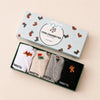 Lot de 5 chaussettes basses. Languettes brodées avec motifs de Noël : pain d'épice, sucre d'orge, teckel de Noël et message Merry Christmas (Joyeux Noël). Coloris : blanc, beige, gris chiné et noir. 