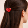 Pince acrylique en forme de coeur rouge