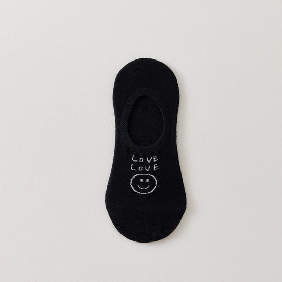 Socquettes invisibles en coton avec motif smiley ou message. Fond noir, blanc ou bleu. Confortables, discrètes et parfaites avec des baskets.