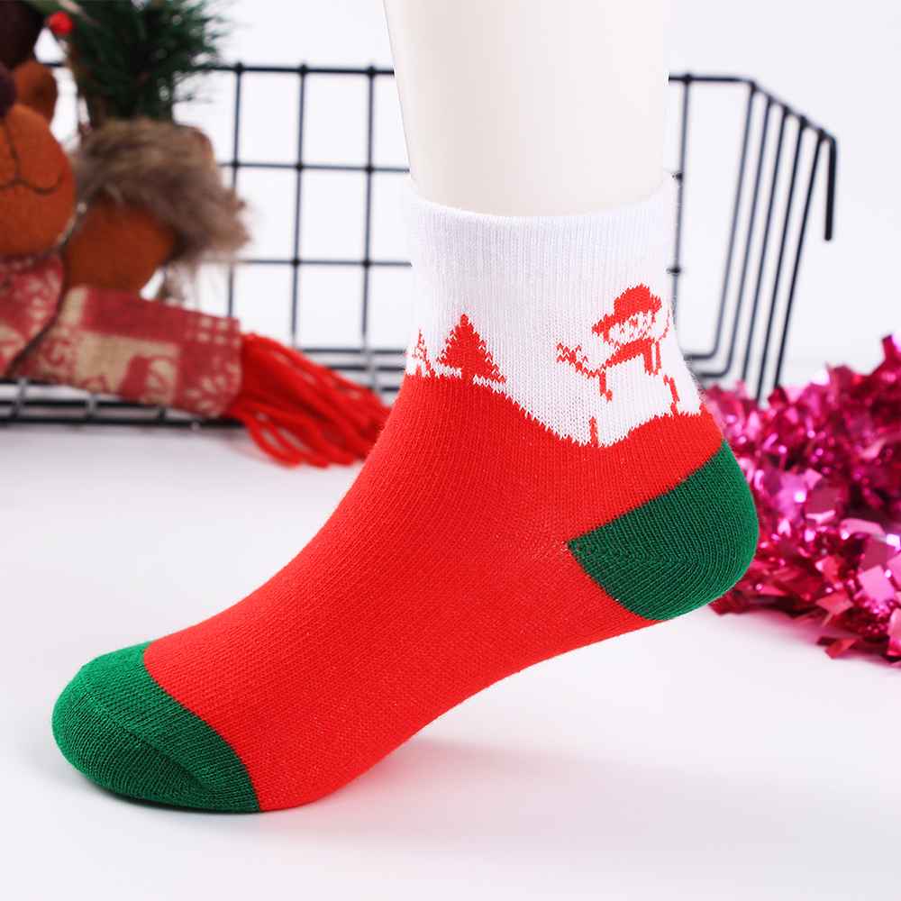 Chaussettes de Noël pour enfants. Coloris rouge, blanc et vert. Motif bonhomme de neige. Idéales pour les fêtes. Pour bébés et enfants (du 12 mois au 12 ans).