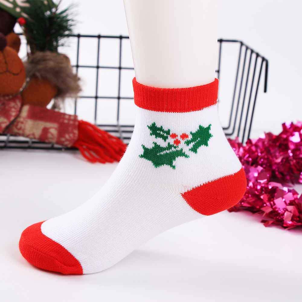 Chaussettes de Noël pour enfants. Coloris rouge, blanc et vert. Motif houx. Idéales pour les fêtes. Pour bébés et enfants (du 12 mois au 12 ans).