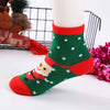 Chaussettes de Noël pour enfants. Coloris rouge, blanc et vert. Motif père noël. Idéales pour les fêtes. Pour bébés et enfants (du 12 mois au 12 ans).